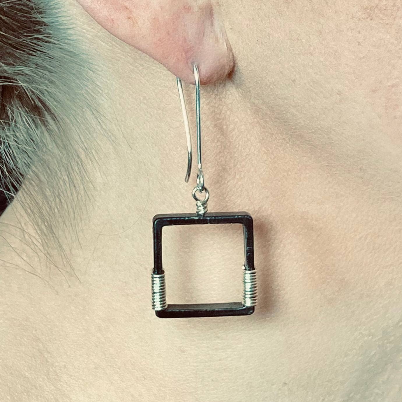 Blackened steel earrings wrapped with silver