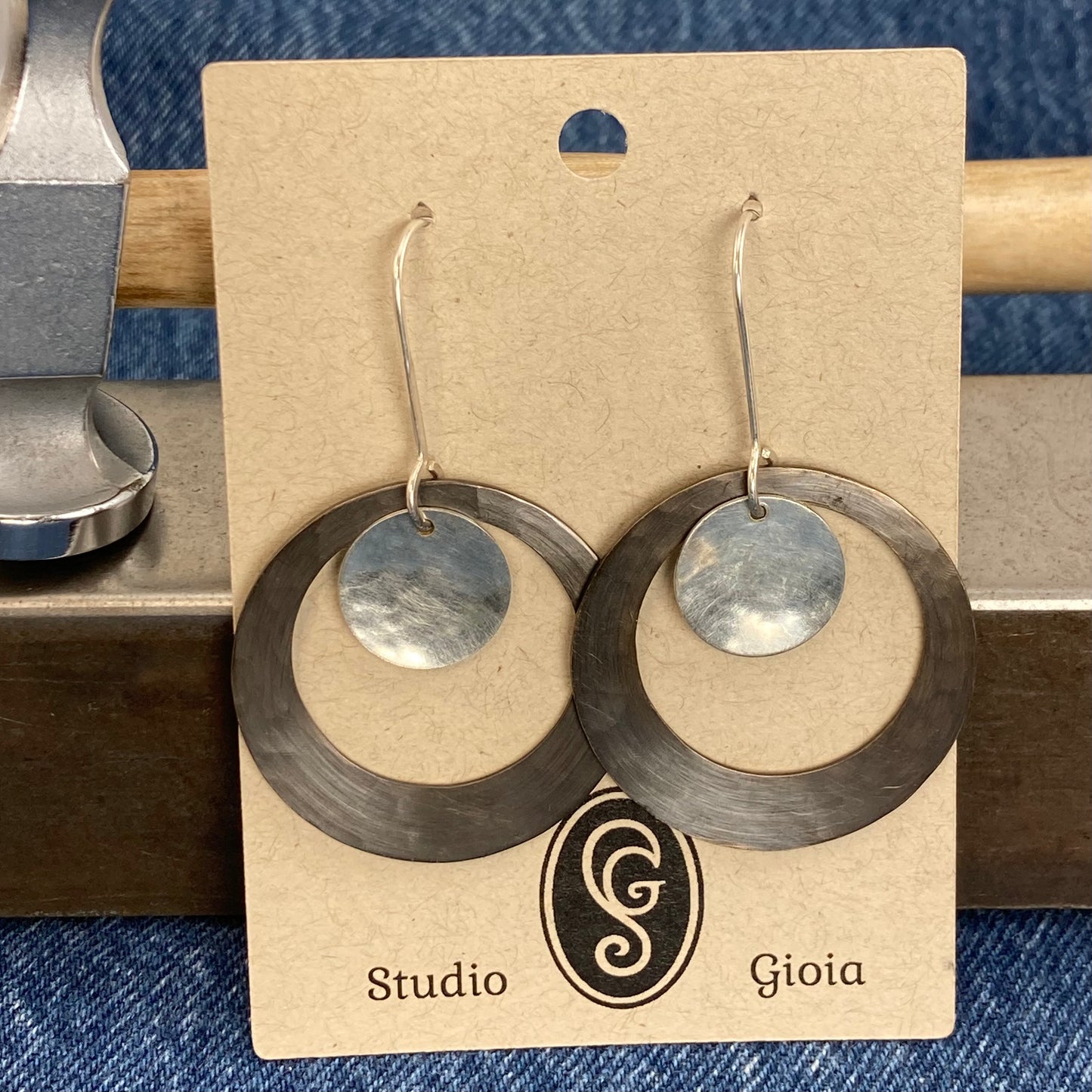 Hand hammered darkened brass hoop and silver dangle earrings
