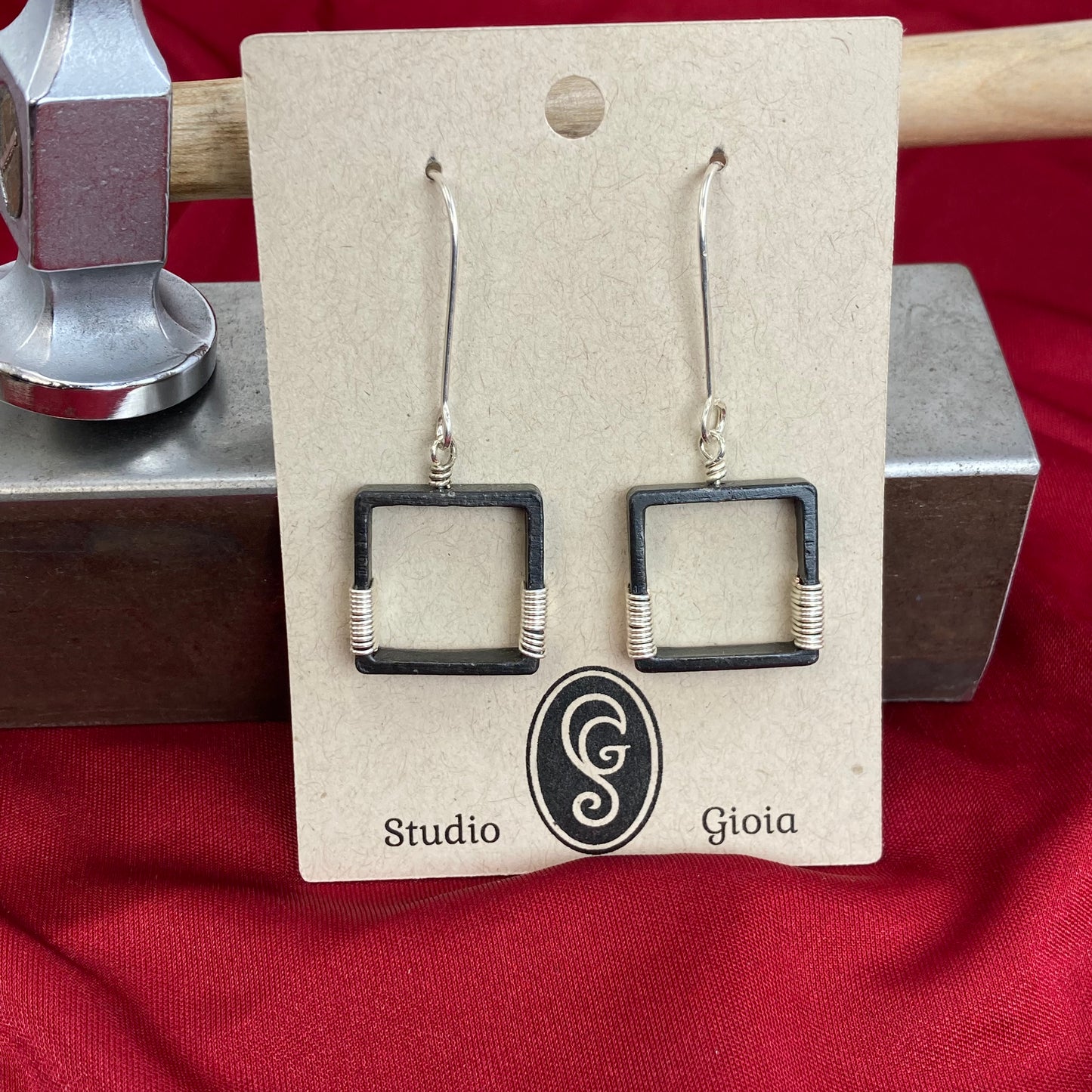 Blackened steel earrings wrapped with silver