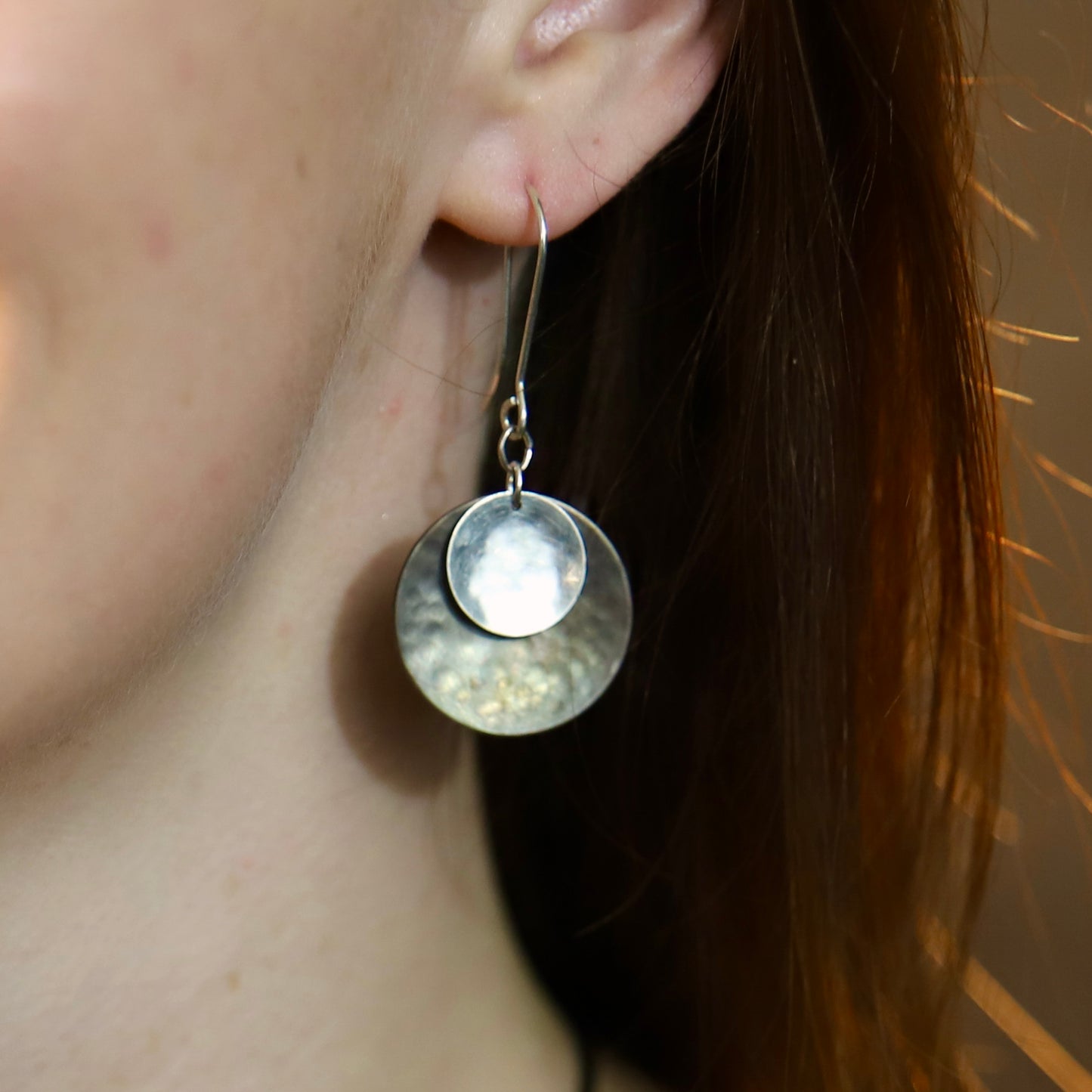 Hand hammered darkened bronze and silver dangle earrings