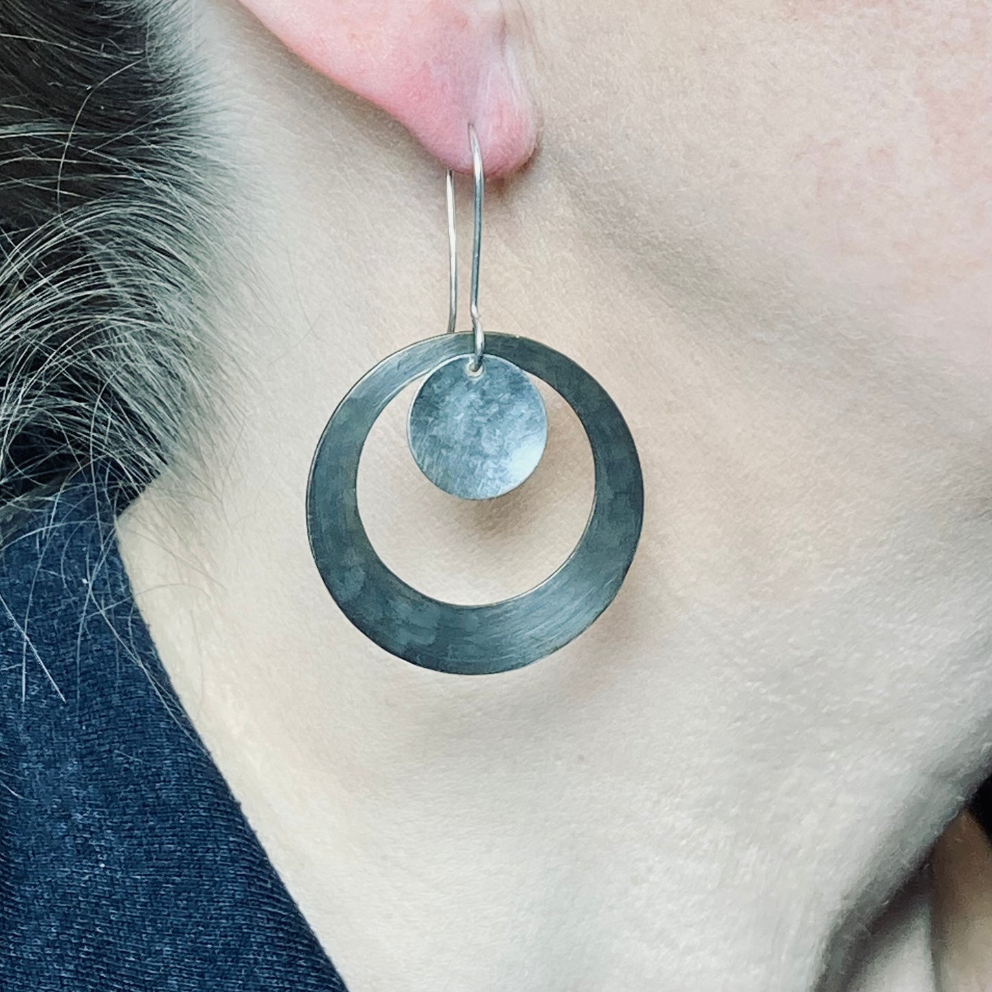 Hand hammered darkened brass hoop and silver dangle earrings