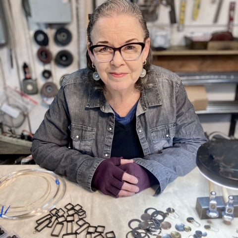 Bronze, silver and blackened steel pendant