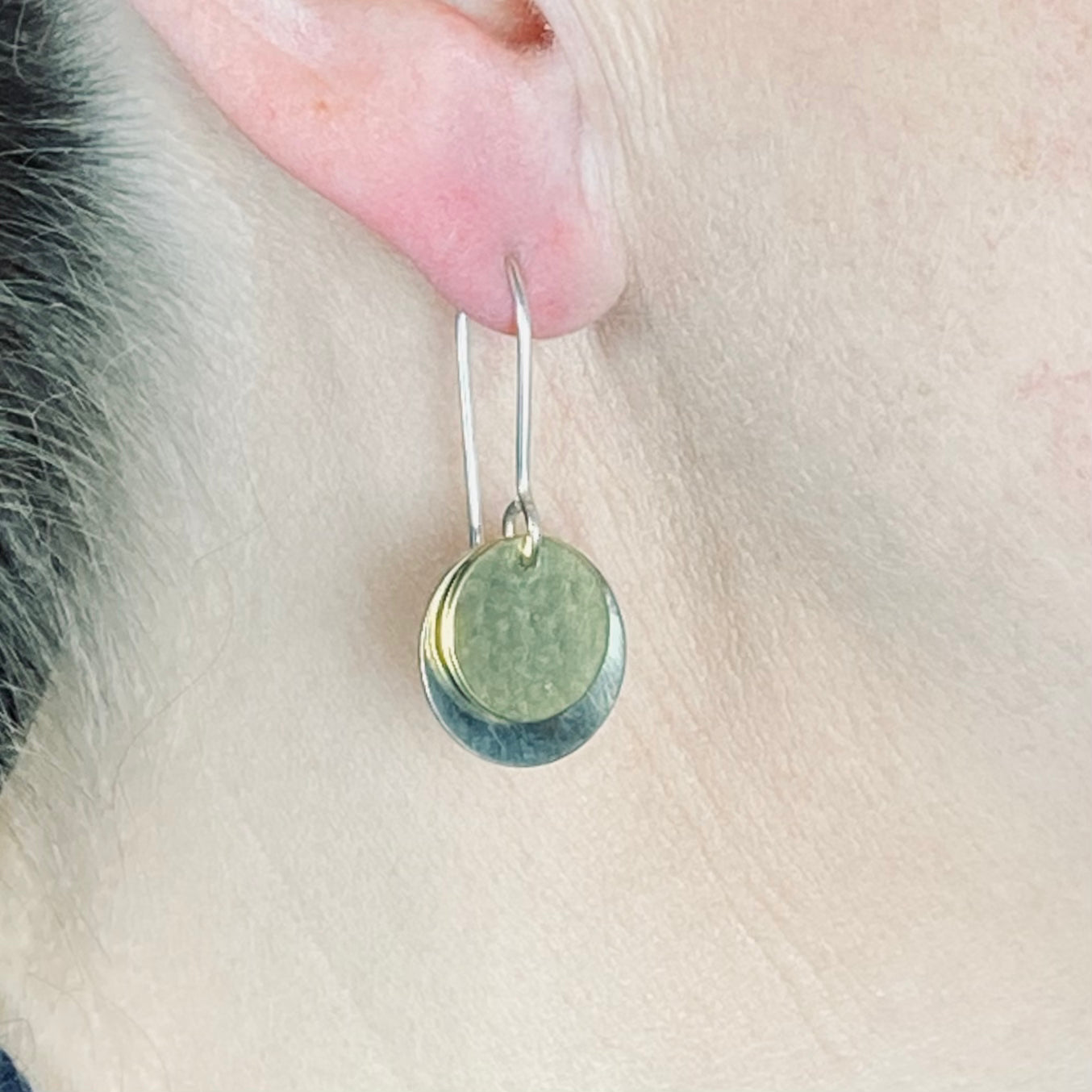 Hand hammered silver and brass dangle earrings