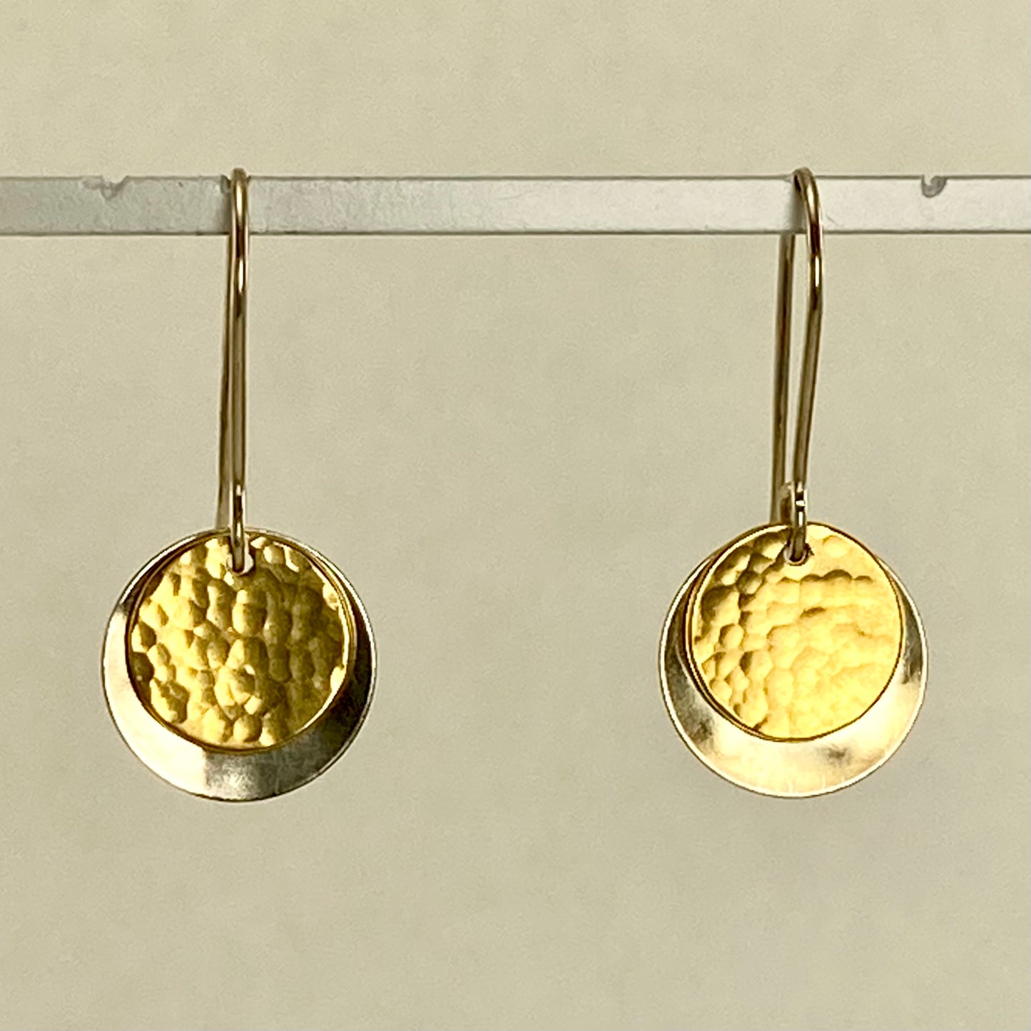 Hand hammered silver and brass dangle earrings