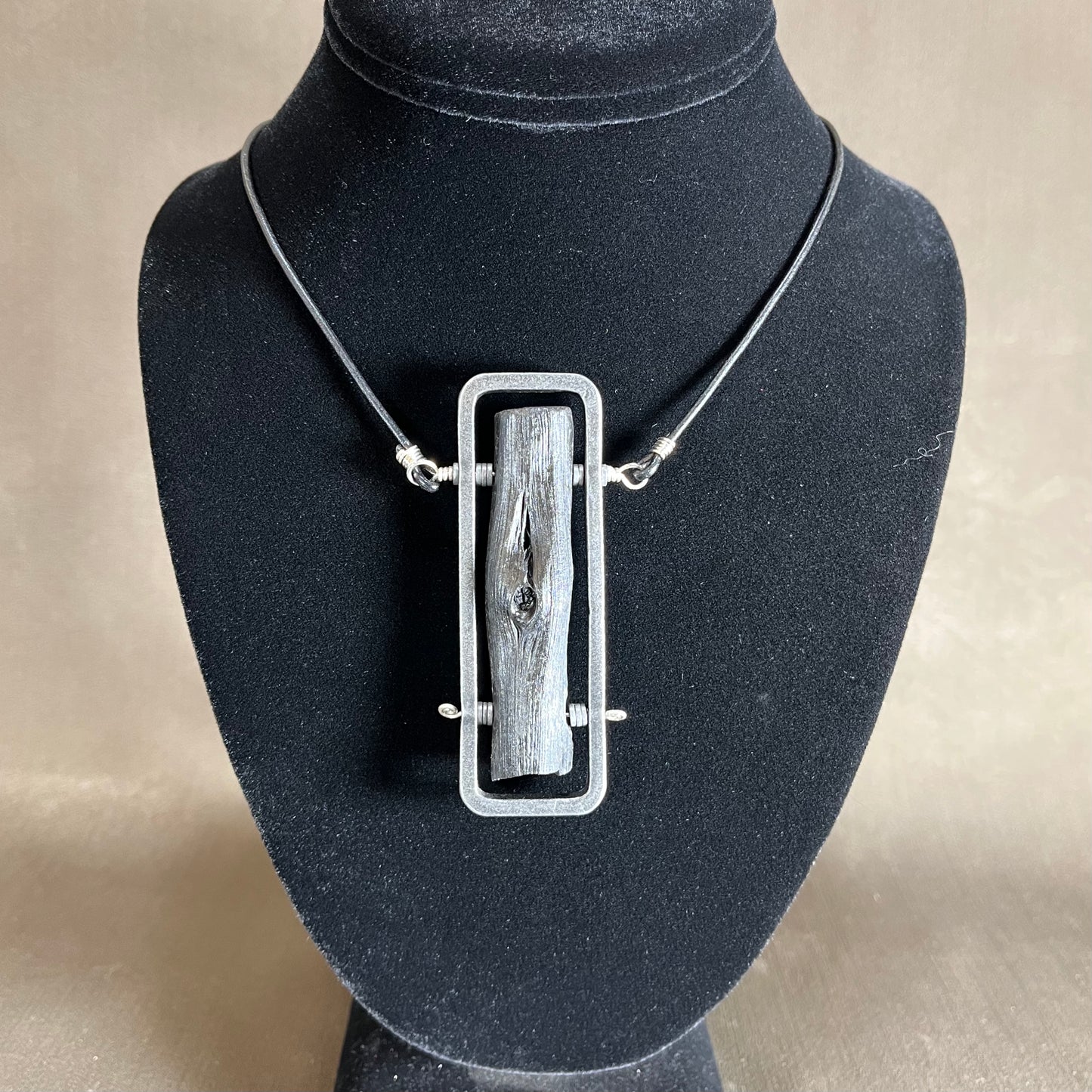 Binchotan steel and silver pendant