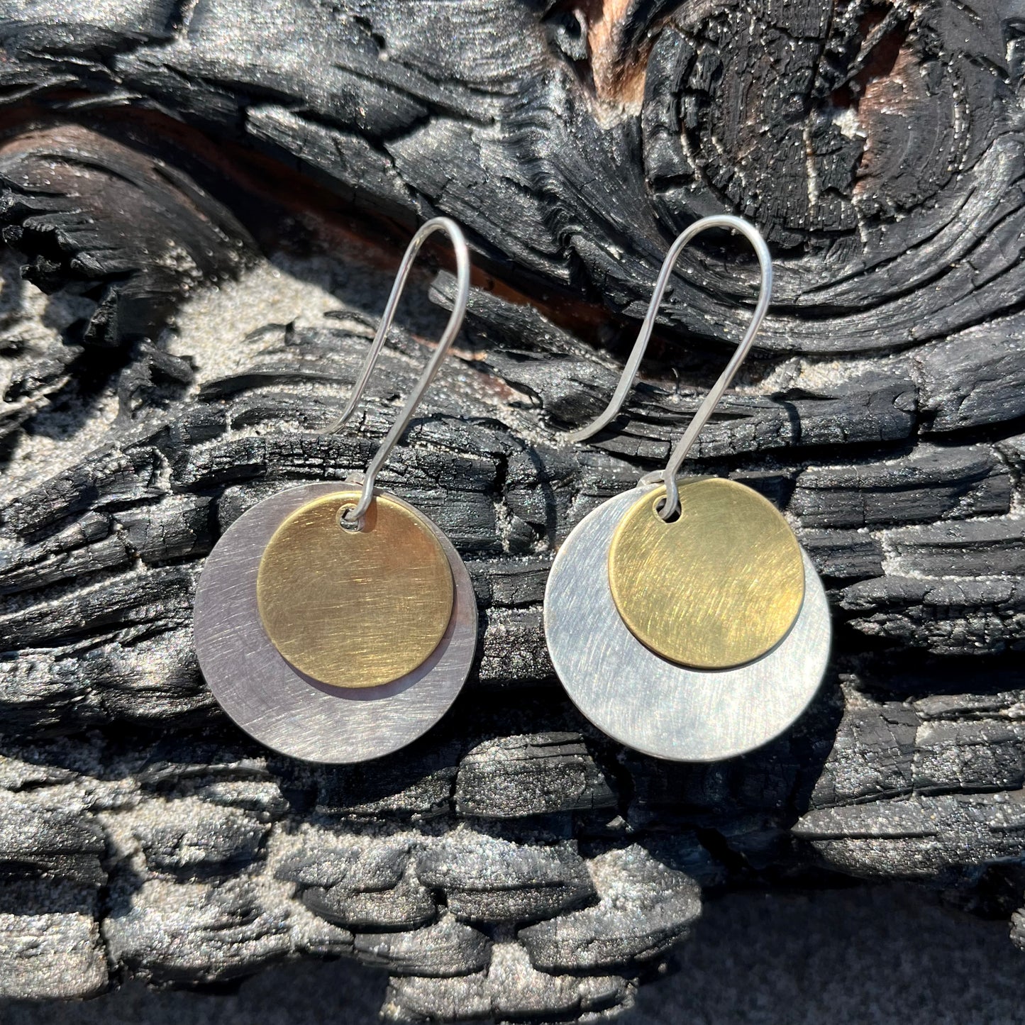 Hand hammered silver and brass dangle earrings