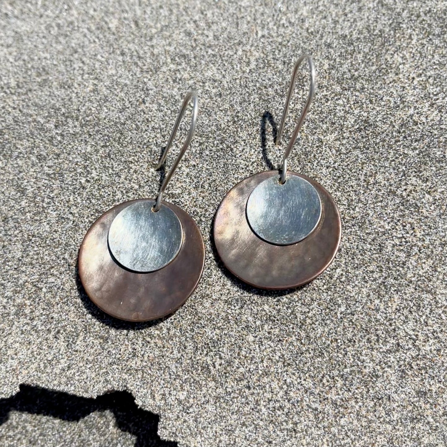 Hand hammered darkened bronze and silver dangle earrings