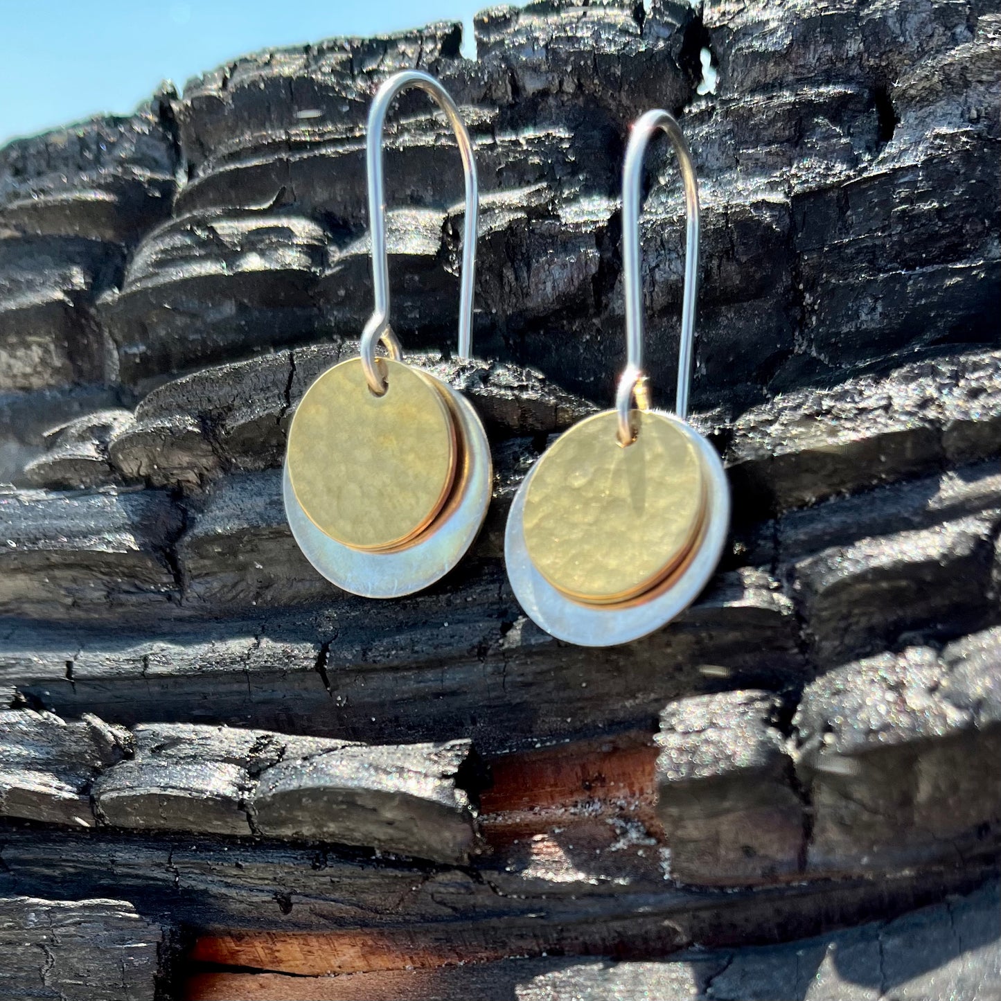 Hand hammered silver and brass dangle earrings