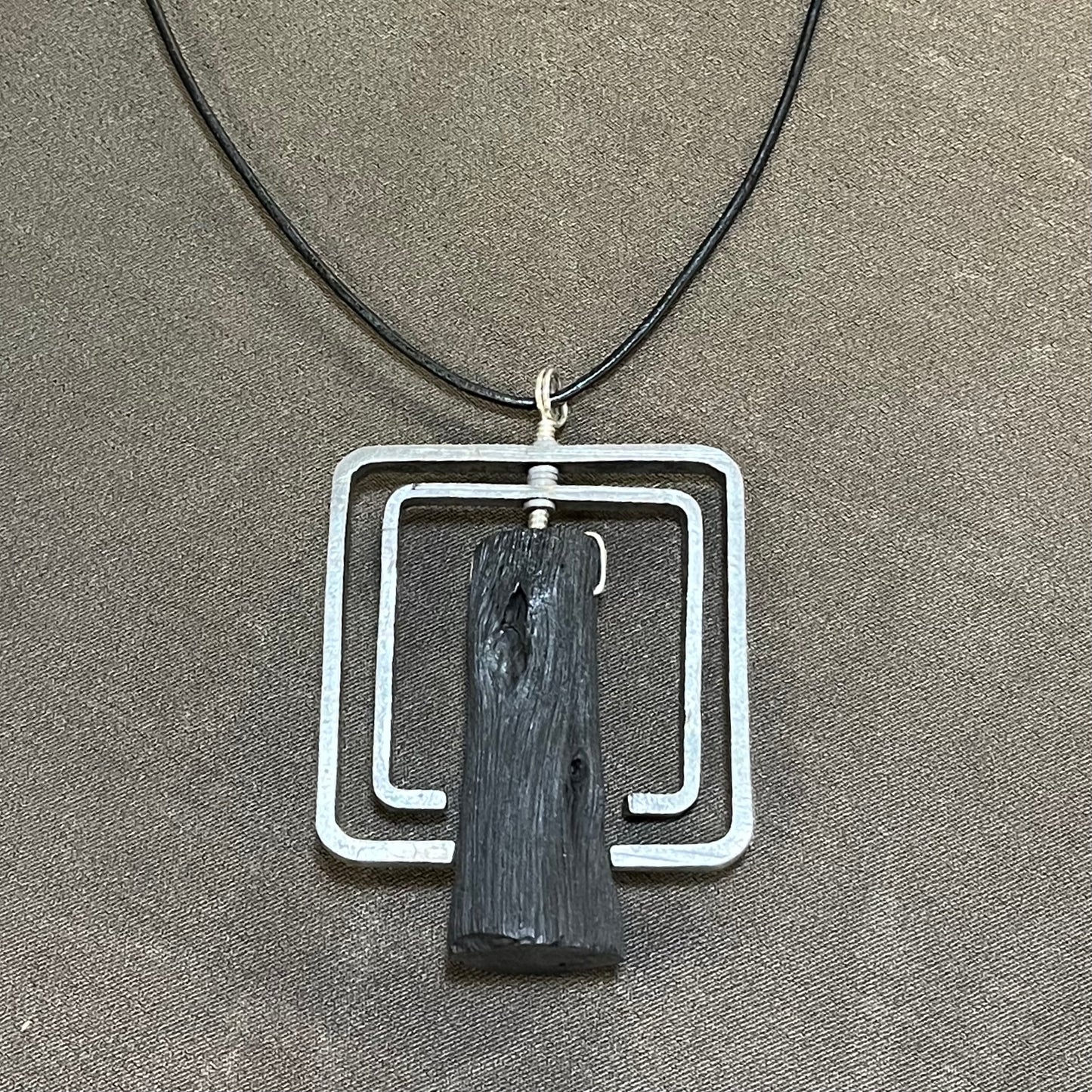 Binchotan and steel pendant