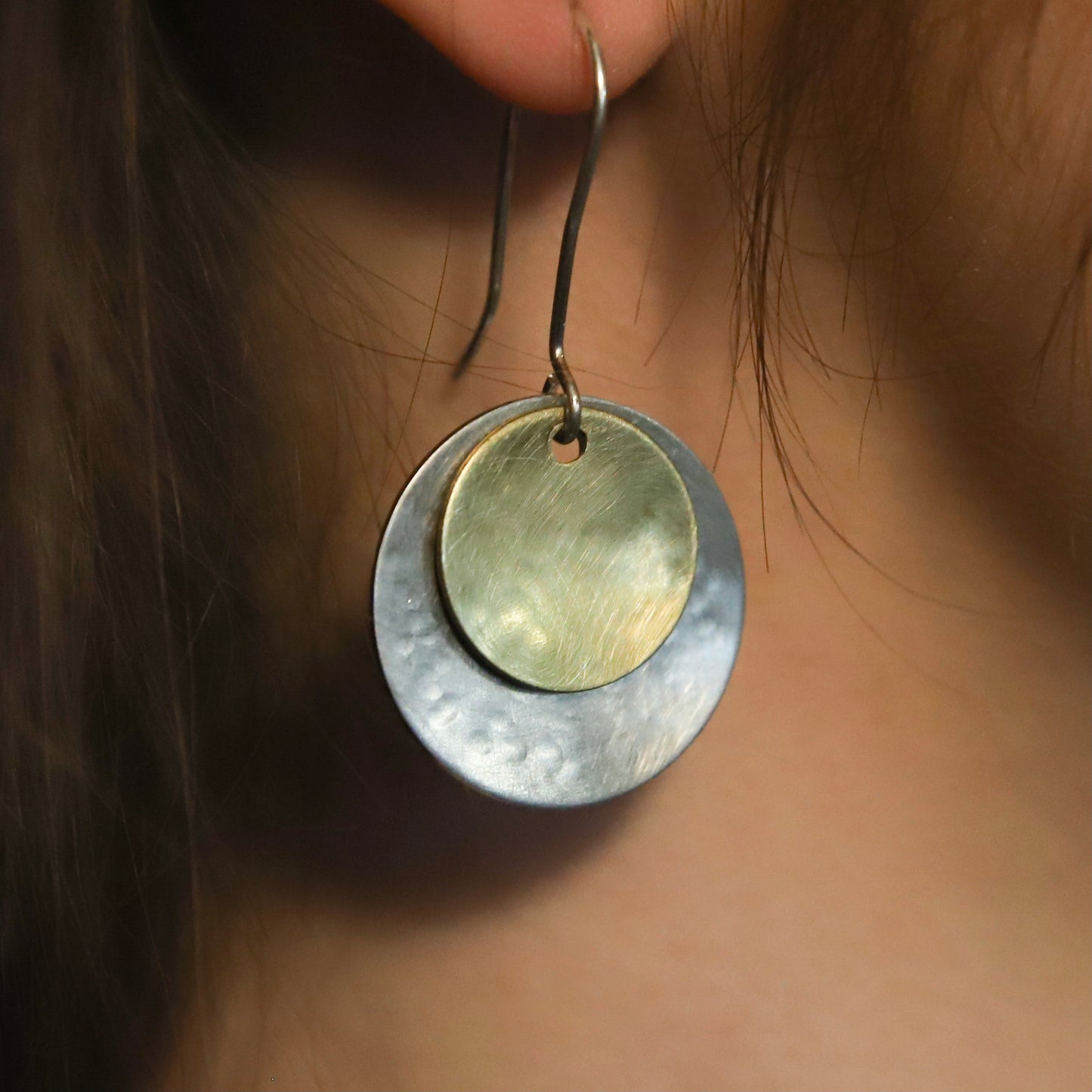 Hand hammered silver and brass dangle earrings
