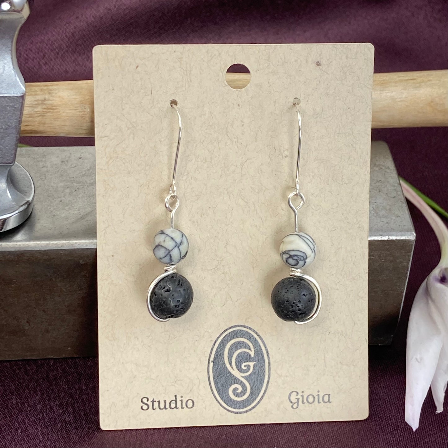 Black lava and white howlite, silver wrapped drop earrings