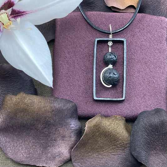 Blackened steel rectangle and lava pendant