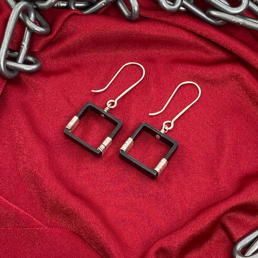 Blackened steel earrings wrapped with silver