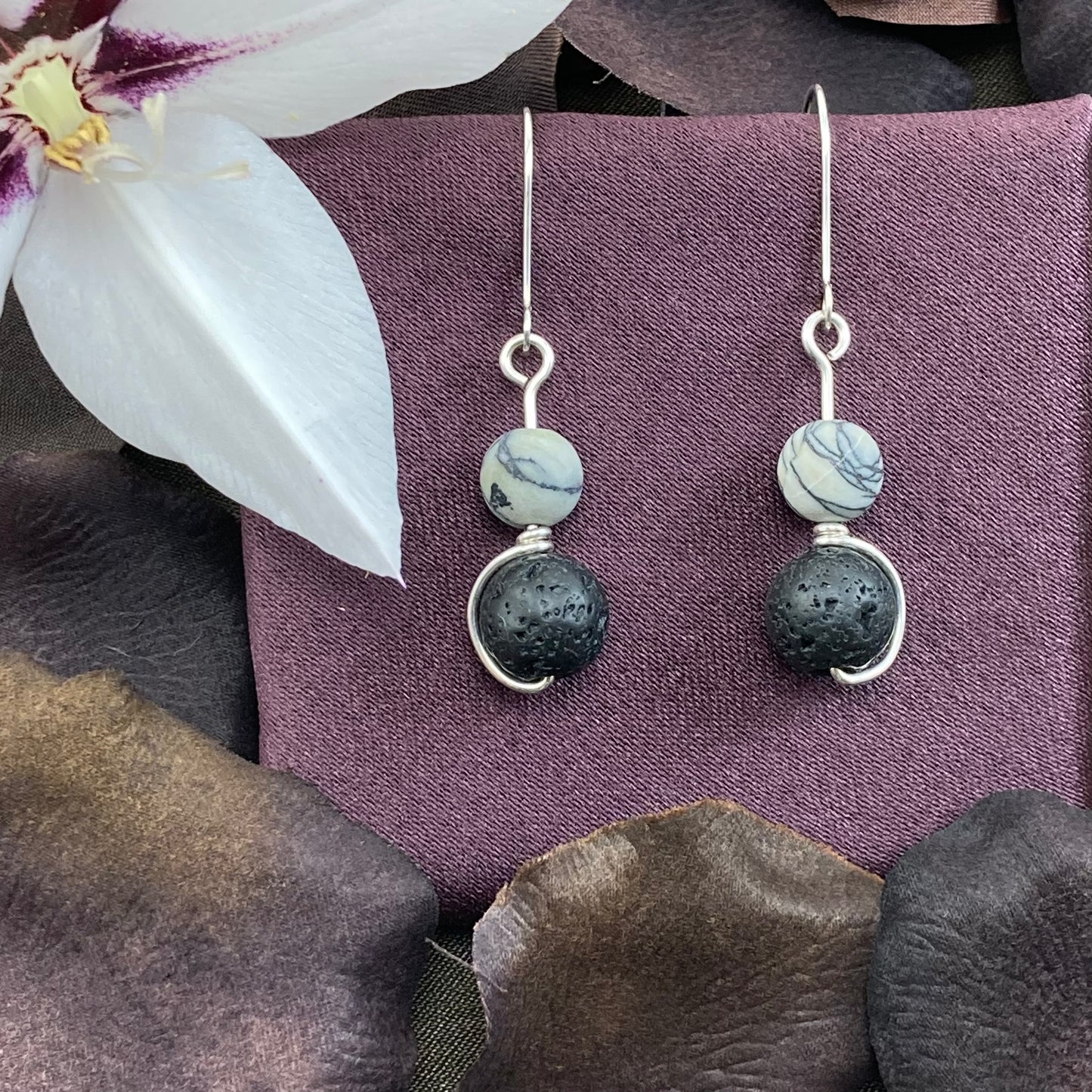 Black lava and white howlite, silver wrapped drop earrings