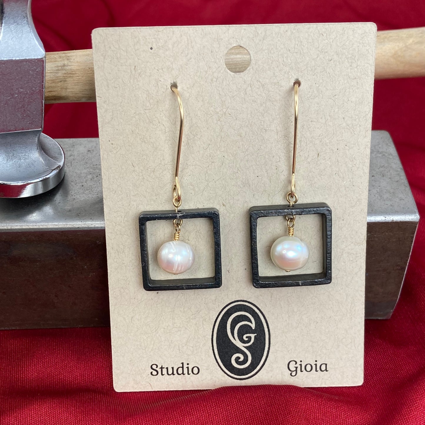Blackened steel and pearl earrings with gold