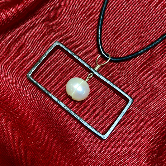 Blackened steel rectangle and pearl pendant