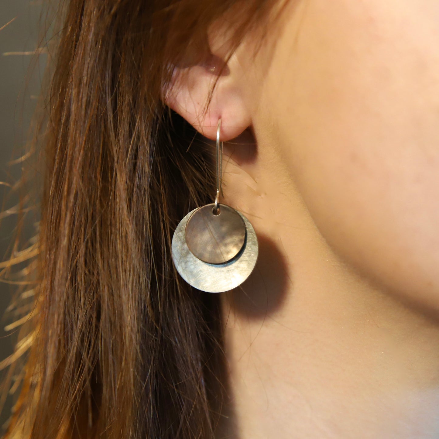 Silver and darkened bronze dangle earrings