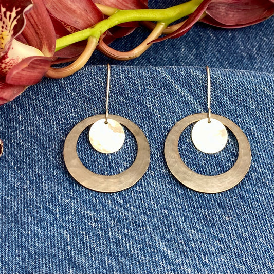 Hand hammered darkened brass hoop and silver dangle earrings