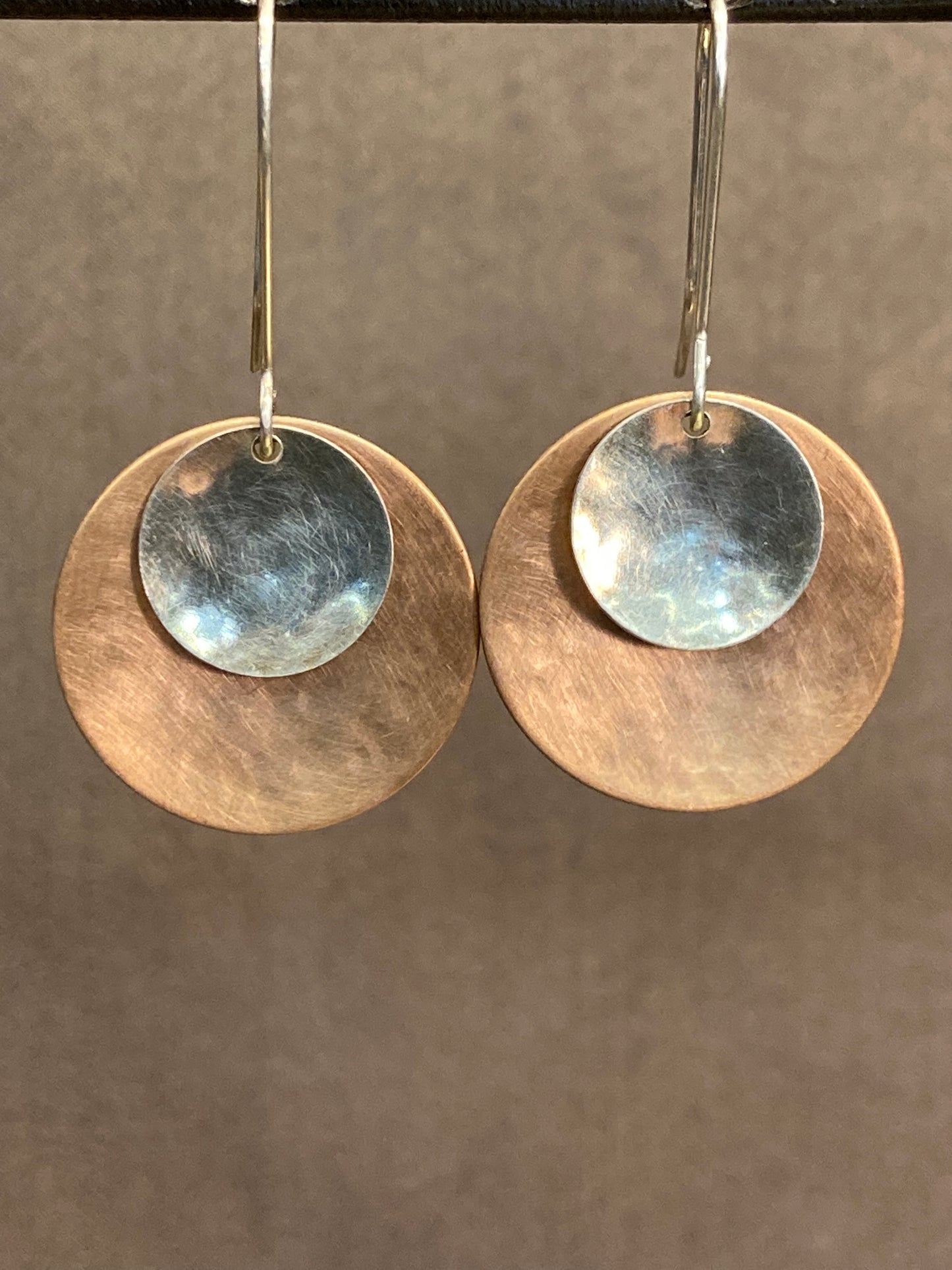 Hand hammered bronze and silver dangle earrings