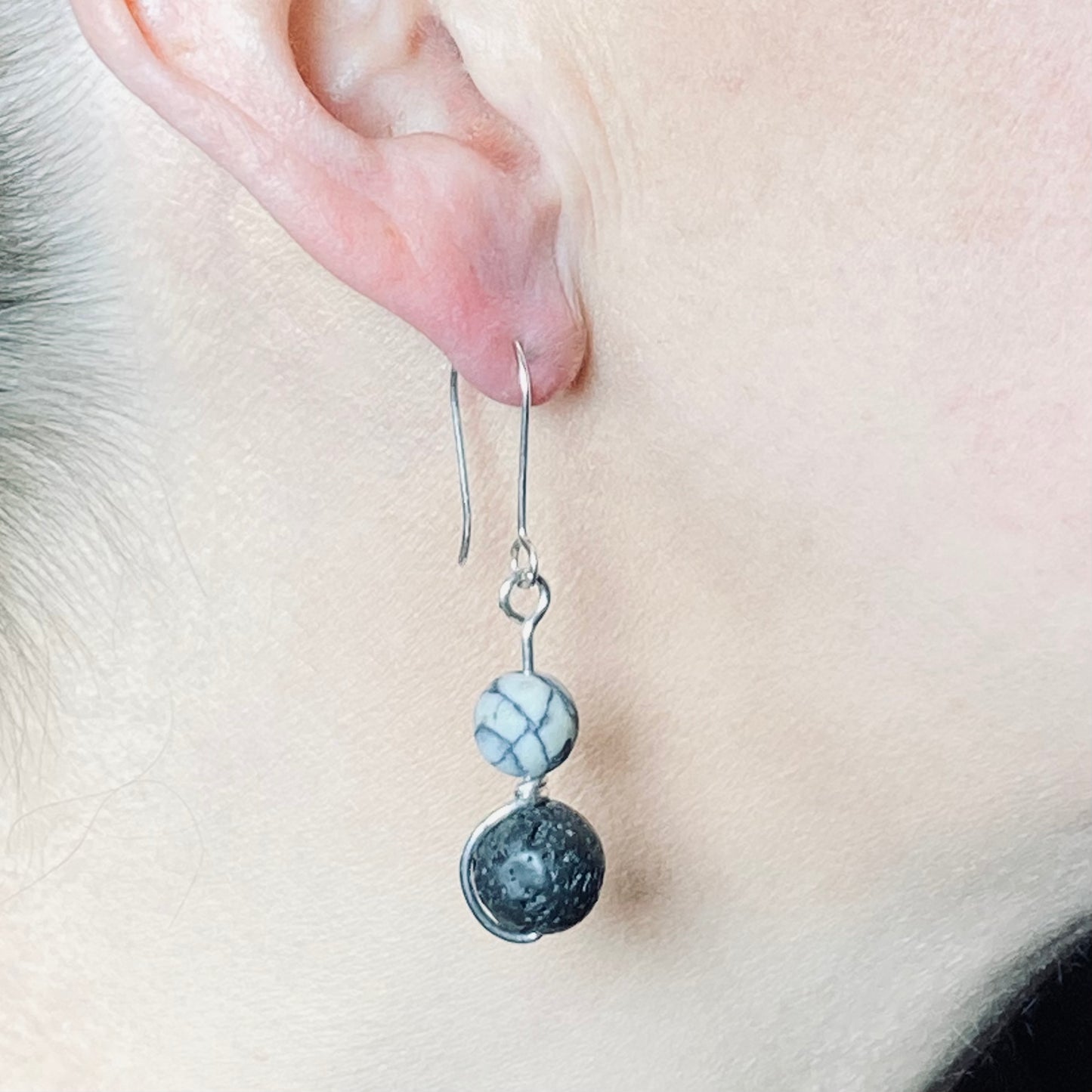 Black lava and white howlite, silver wrapped drop earrings