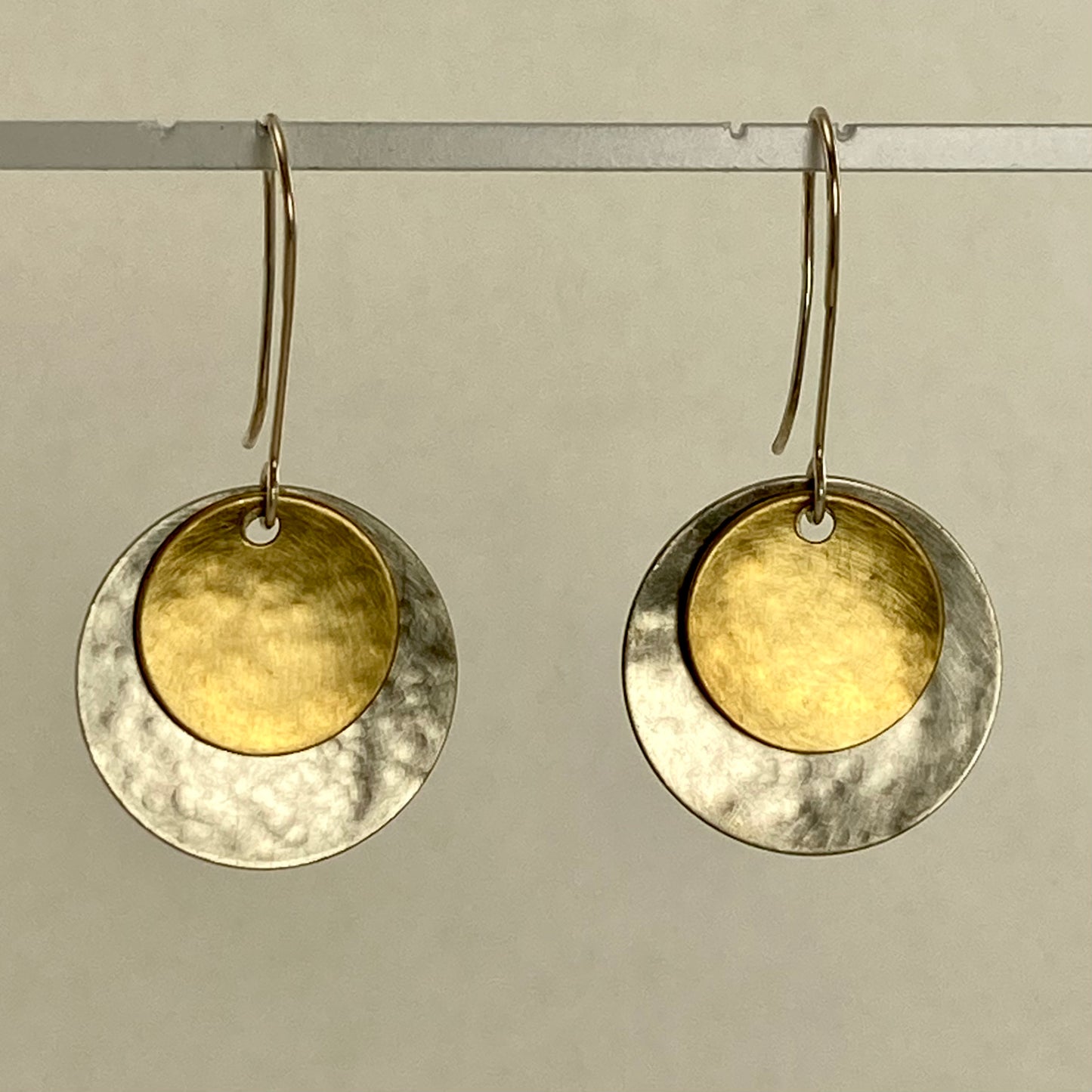 Hand hammered silver and brass dangle earrings