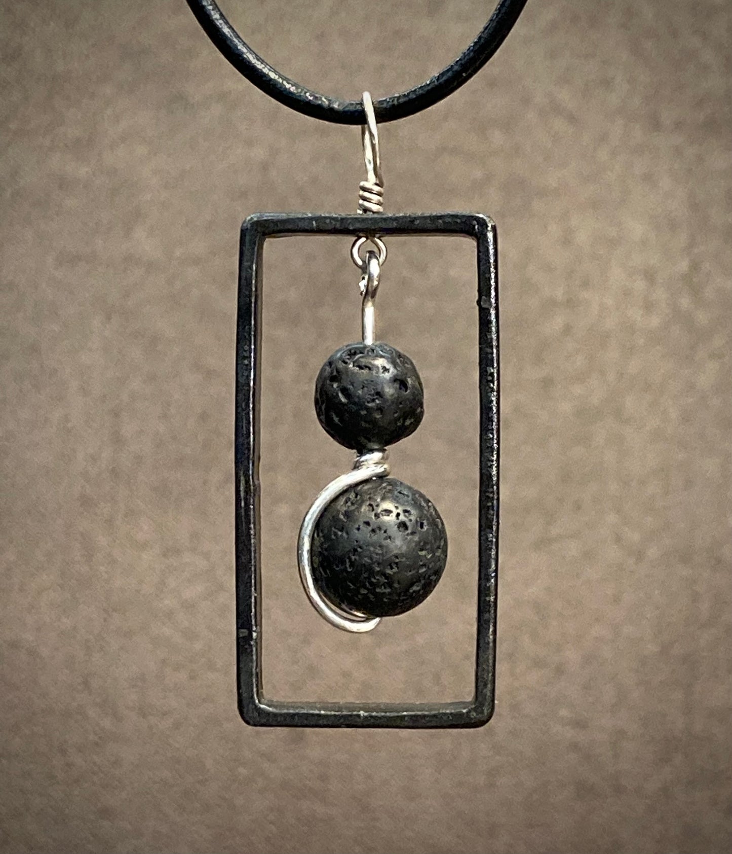 Blackened steel rectangle and lava pendant