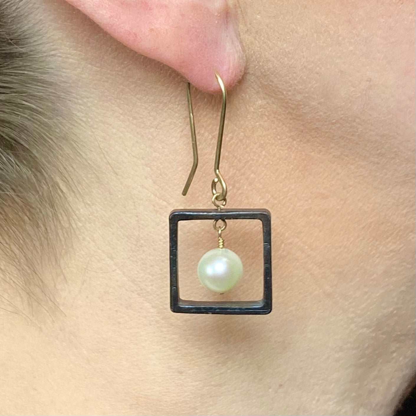 Blackened steel and pearl earrings with gold